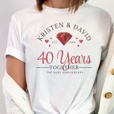 a woman wearing a white t - shirt with the words 40 years together printed on it