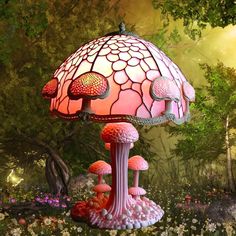 a pink lamp sitting on top of a lush green field next to trees and flowers