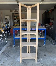 a wooden shelf sitting in the middle of a garage