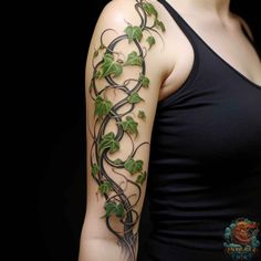 a woman's arm with vines and leaves on it