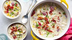 two white bowls filled with soup on top of a table