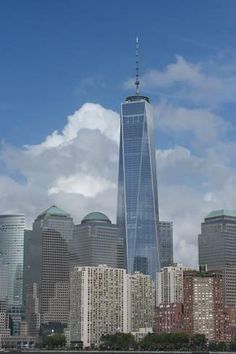 the skyline of new york city with one world trade center in the foreground