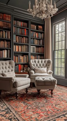 a living room with two chairs and a couch in front of a bookshelf