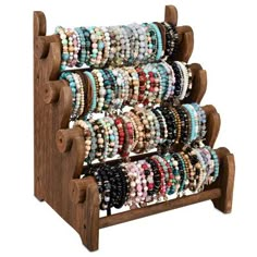 a wooden rack with bracelets on it