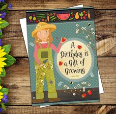 a birthday is a gift of growing card on a wooden table with flowers and sunflowers