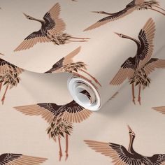 a wallpaper with cranes on it in brown and tan colors, against a white background