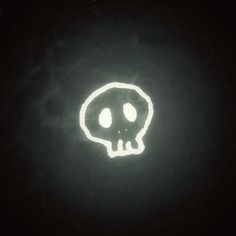 a glowing skull is seen in the dark