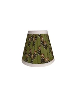 a green lamp shade with flowers on it