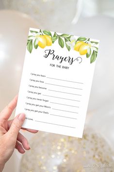 a person holding up a yellow lemon themed wedding game