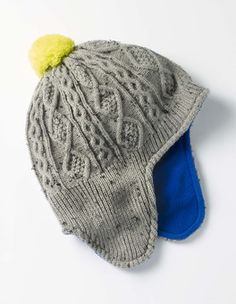 a knitted hat with a yellow pom - pom on the brim