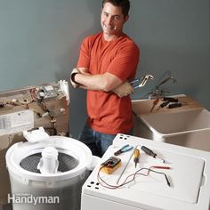 a man is standing next to some electrical equipment and his arms are folded out in front of him