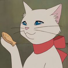 a white cat with blue eyes holding a piece of food