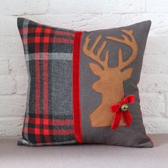 a decorative pillow with a deer on it