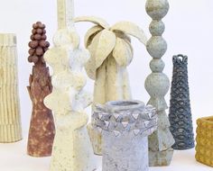 many different colored vases are lined up together