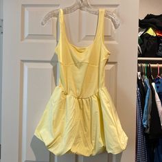 Brand New Without Tags. Size Small But Very Stretchy. Mini Bubble Skirt Dress In Yellow. Can Be Dressed Down With Sandals Or Sneakers And Can Be Dressed Up With Heels. Bubble Skirt Dress, Luxury Activewear, Floral Wrap Maxi Dress, Yellow Tank, Flowy Mini Dress, Golf Dresses, Black Satin Dress, Bubble Skirt, Sleeveless Bodycon Dress