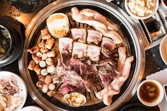 an overhead view of meats and other food items