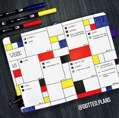 a calendar with markers and pens next to it