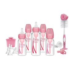 the baby bottles are lined up with toothbrushes and other things to use them