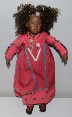 We are offering a beautiful Annette Himstedt RARE Kleine NTATHI Club Doll 13" L.E~13 Worldwide Circa 2005.  This cutie has hand painted features, brown curly hair with colorful beads. She comes wearing her original outfit with sandals.  The doll and outfit are both in excellent condition. Take a moment to visit our shop for more interesting and unique items. Our items are guaranteed and we add weekly so check back often. Thank you for looking. Outfit With Sandals, Brown Curly Hair, Black Dolls, Sandals Outfit, Black Doll, Unique Items, Doll Toys, Curly Hair, Beautiful People