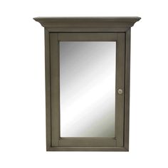 a small mirror on top of a wooden cabinet