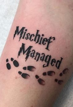 a person with a tattoo on their arm that says,'mischifer managed '