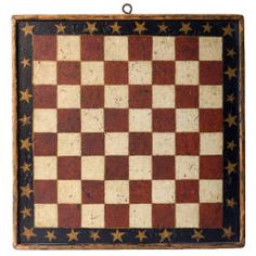 an old wooden chess board with stars on it