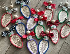 some ornaments are laying on the floor with ribbons and bows hanging from it's sides