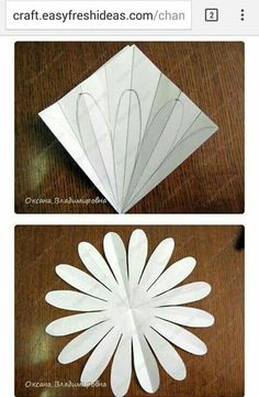 some paper flowers sitting on top of a table