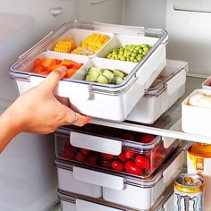 a refrigerator filled with lots of different types of vegetables and fruit in containers on the shelves