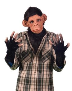 a man wearing a monkey mask and holding his hands up to the side with both hands