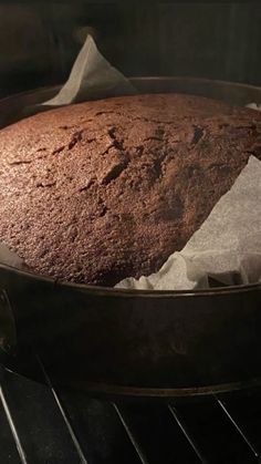 a cake is sitting in an oven and ready to be baked