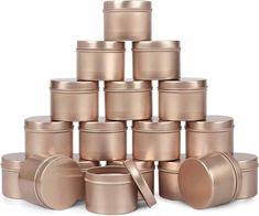 many different sizes and shapes of tins on a white background with one in the middle