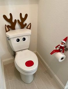 a toilet decorated to look like a reindeer