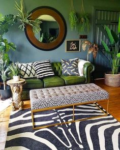 a living room filled with furniture and plants