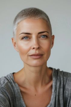 A low maintenance buzz cut, embracing simplicity and boldness. An empowering and straightforward choice for 40-year-old women valuing ease and a clean look. Click to see more! Long Sleek Hair, Short Sassy Hair, Super Short Hair