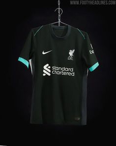 the new liverpool away shirt is displayed on a hanger in front of a black background