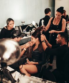 a group of people getting their hair done