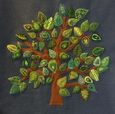 a tree made out of leaves on a blue background