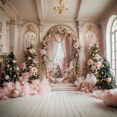 a room decorated for christmas with pink and gold decorations on the walls, trees, and other ornaments