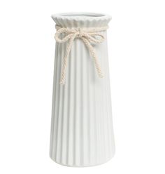 a white vase with a rope tied around the top and bottom, on a white background