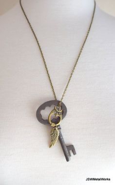 Large Antiqued Brass #Vintage #Steampunk Skeleton Key #Necklace with Owl & Wing #brassnecklace #brassjewelry #antiquedbrass #steampunkjewelry #steampunknecklace #vintagekey #skeletonkey #etsyshop #etsystore #etsyfinds #jswmetalworks #jewelry #etsyhandmade #unisexjewelry Vintage Brass Necklaces With Two Keys, Steampunk Jewelry With Keys For Gifts, Vintage Metal Jewelry With Keys Detail, Vintage Metal Jewelry With Keys, Vintage Pendant Jewelry With Keys, Vintage Metal Key Jewelry, Vintage Gold Jewelry With Keys, Bronze Brass Necklace With Keys, Steampunk Brass Necklace With Antique Finish