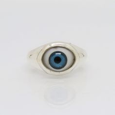 Sterling Silver Evil Eye Blue Dome Ring ...Marked 925...Total of weights 3.9grams...Size 6...Measure of Face 11.3MM...It's in very good condition. Blue Sterling Silver Rings With Polished Finish, Blue Sterling Silver Ring With Polished Finish, Classic Blue Turquoise Ring In Sterling Silver, Classic Blue Turquoise Sterling Silver Ring, Blue Open Ring With Polished Finish, Blue Classic Sterling Silver Signet Ring, Classic Blue Sterling Silver Signet Ring, Handmade Blue Sterling Silver Signet Ring, Blue Sterling Silver Open Ring