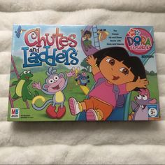 the children's board game, chutes and ladders is sitting on a bed