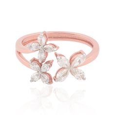 a pink gold ring with two flowers on it