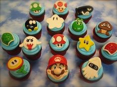 there are many cupcakes that have different designs on them, including mario and luigi