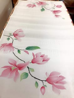 a bed with pink flowers painted on it