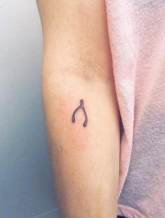 a person with a small tattoo on their arm