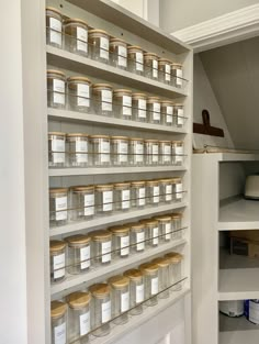 the shelves are filled with many different types of jars