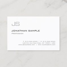 a white business card with the letter u s on it's front and bottom corner