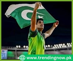 a man holding a pakistan flag in his hands